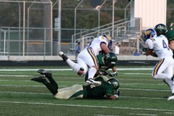 Jeremy Best gets one of 140 tackles with help from Doug Hubnik  