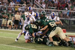 Taylor Hocutt, Justin Monfils, Johnny Cervantes, and Alex Kemp get a team tackle against Blanco