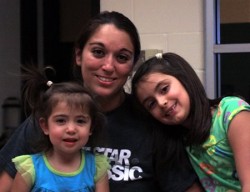 Head Coach Nicole Creek with her two daughters