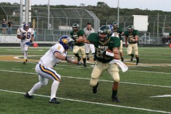 Tight End Jeremy Fulton knocks the 'gnat' out of the way on his 21 yard catch and run