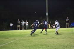 Zach Fasenmyer and Donald Loving catch a Wildcat