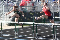 Rebekah Flint hurdling to the Finish Line