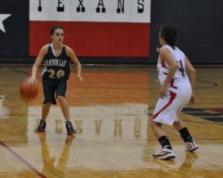 Olivia Flores sizing up the opponent to set up the Hawk's Offense.