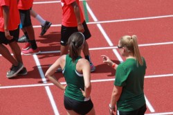 Marisa Ellis getting some pointers from Track Coach Lacey Lambert at State