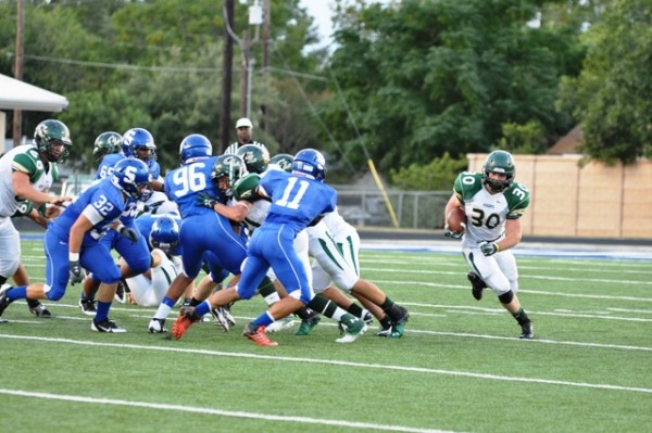 McGuire Johnson waves to Offensive Lineman as they pave a way to the end zone.