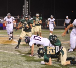 Tommy Clark and Austin Acosta tackling a Texan