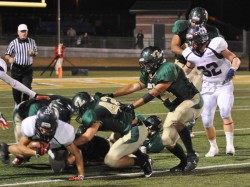 Linebacker Jared Bruckman and Javier Mendez team up for another tackle.