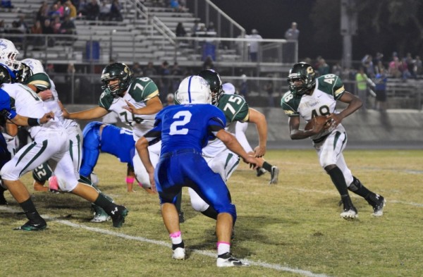 Sophomore Running Back Robert Woods running over Bandera