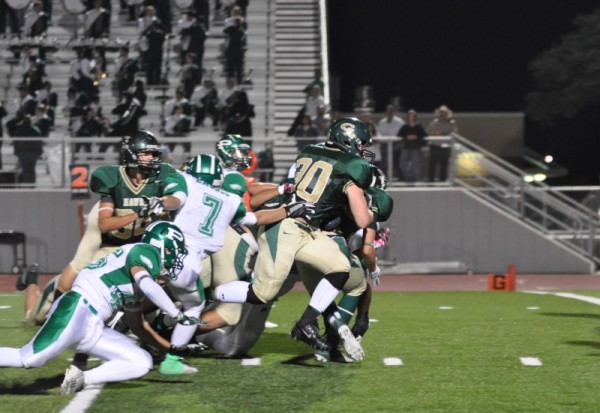 Pleasanton is nice enough to lend a hand in pushing McGuire Johnson over the goal line.