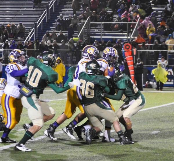 Austin Acosta and TJ Jones tackle a Leopard in Area play 