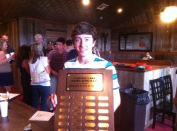 Garrett Winters will need to use a glove for next year's ceremony to protect his hand while holding this plaque.