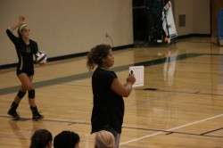 Coach Kim Paisley giving instructions for a serve