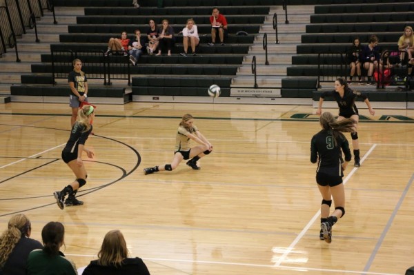 Hayley Melone is Digging it, after a 3-0 sweep over Navarro.