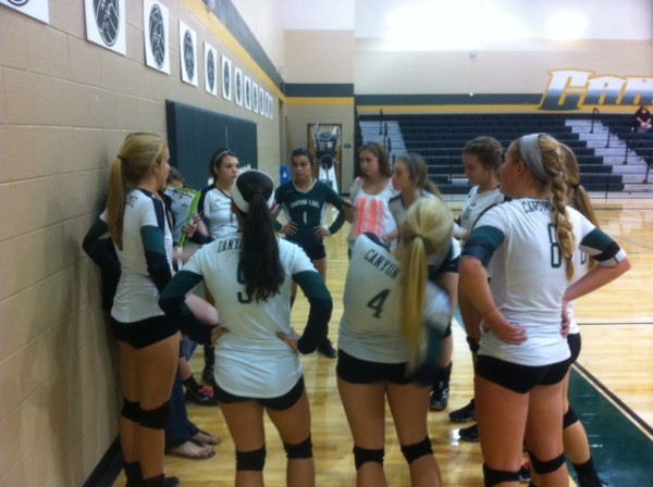 The Undefeated CLJV take instructions after sweeping Navarro on Tuesday night.