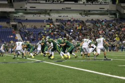 Tanner McGill diving for a chance to tackle a Pirate