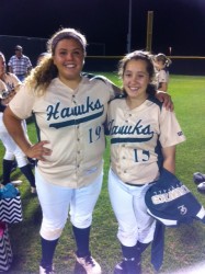 Senior's Kelsey Ahrens and Lizzy Henderson taking in their last time as Hawk Softball players