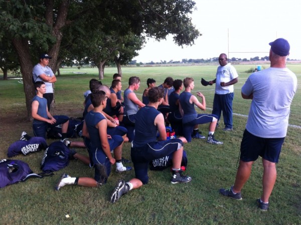 Head Coach Hosea Stredic has a teaching moment after scrimmage last Friday