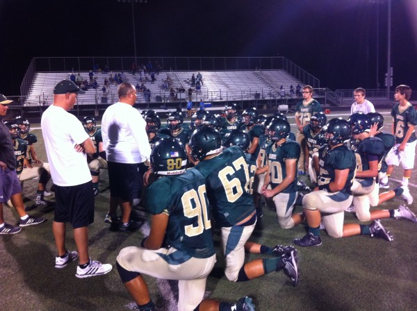 Coaches giving instructions after tough loss to Lampasas