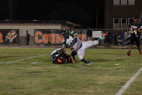 Hawk HEB workers filling some Sacks with Smithville's Quarterback