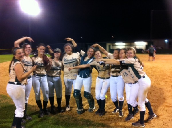 The Hawks pointing to Tiare Kacir after getting the winning hit against Wimberley