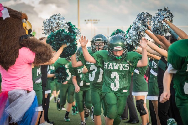 Damien Nichols leads the victorious MV Hawks 8th B team through a victory line