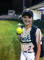 Carly Dubois shows off the ball that left the yard