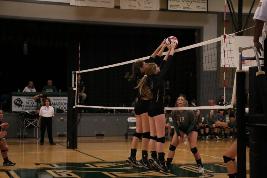 Senior Zoe Edwards and Sophomore Paige Bower with a Block