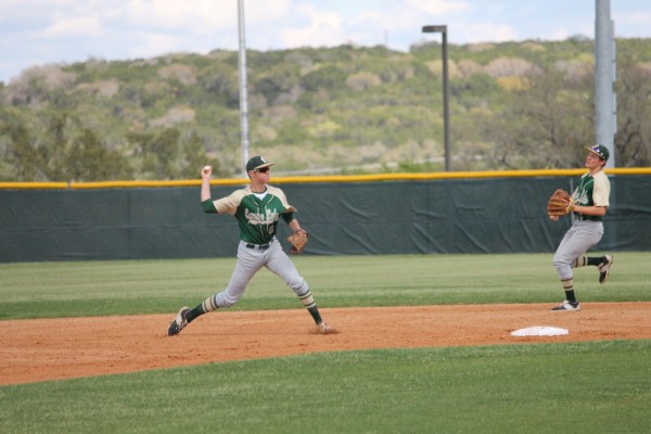 Junior Rory Preiss throwing to 1st Base while the season jumps into the 2nd week