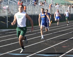 Junior Eduardo Covarrubias running in the Hawks Tri-Meet