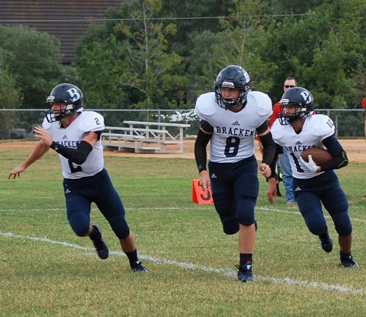 Lucas McCrum looking for blocks from Presley Day and Brady Beene